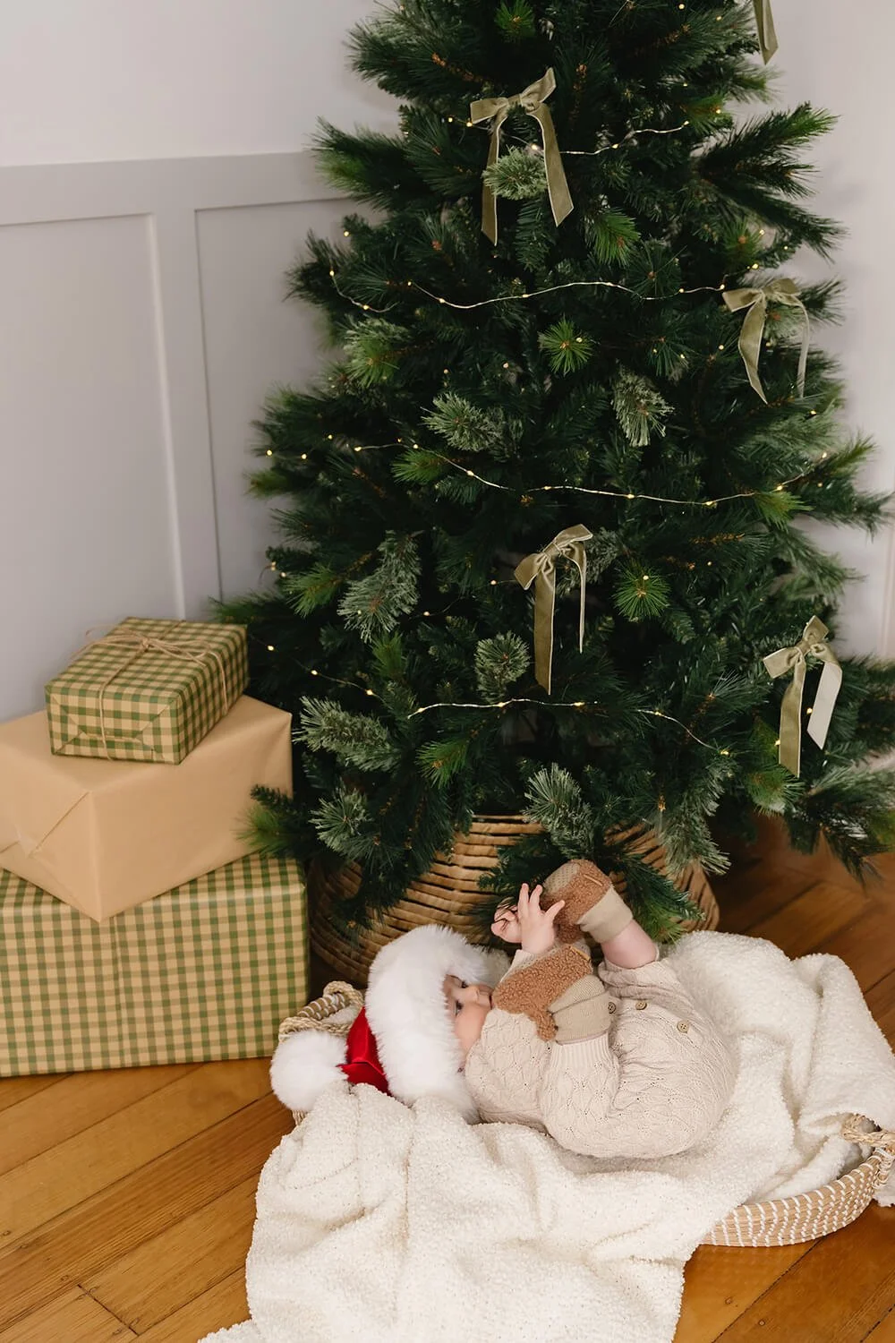 Baby in front of Christmas tree at Hobart Christmas mini session