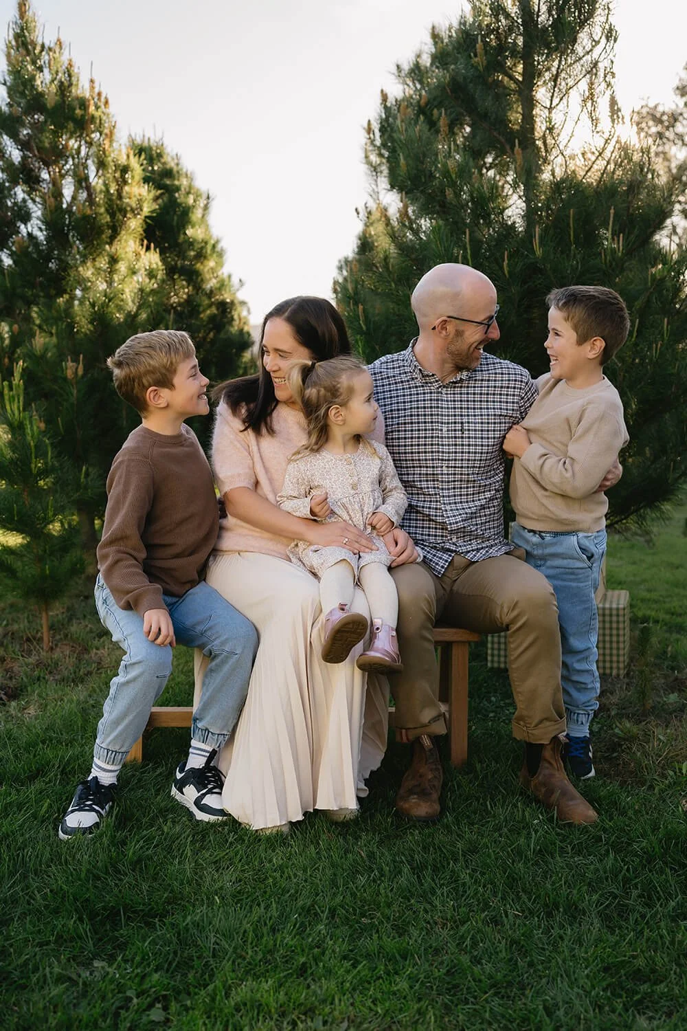 Family Christmas photos amongst the Christmas trees at Coal Valley Christmas Tree Farm in Richmond, Tasmania