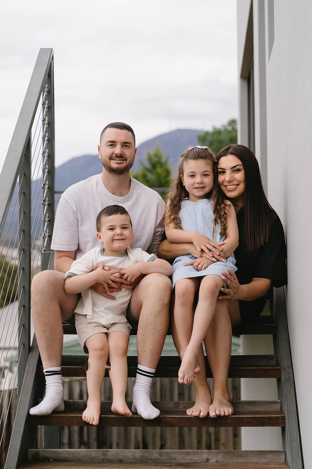 Family sitting on steps at Hobart family photoshoot