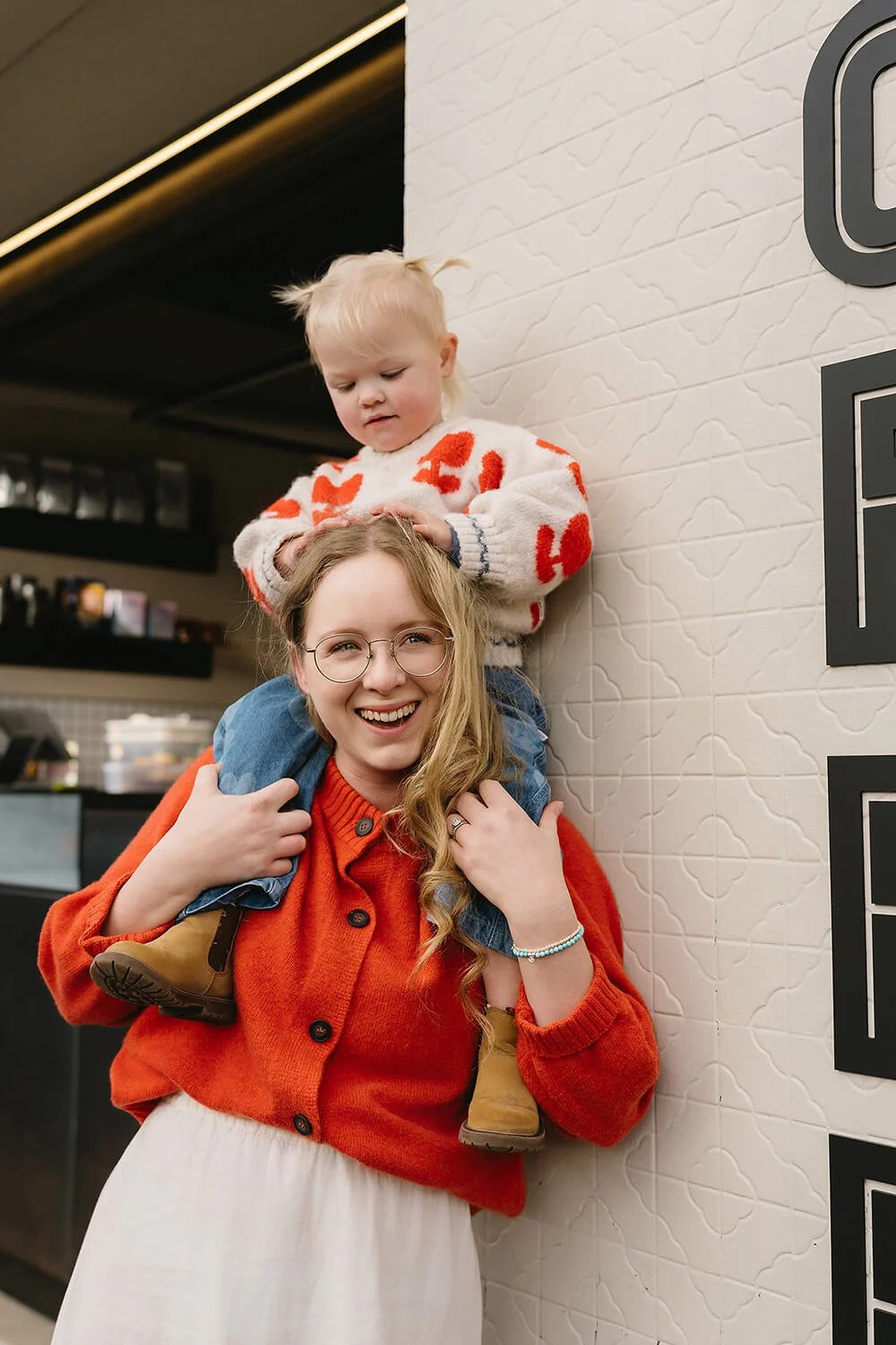 Mother and daughter enjoying a quiet babycino together during a Motherhood Photography session in Hobart.
