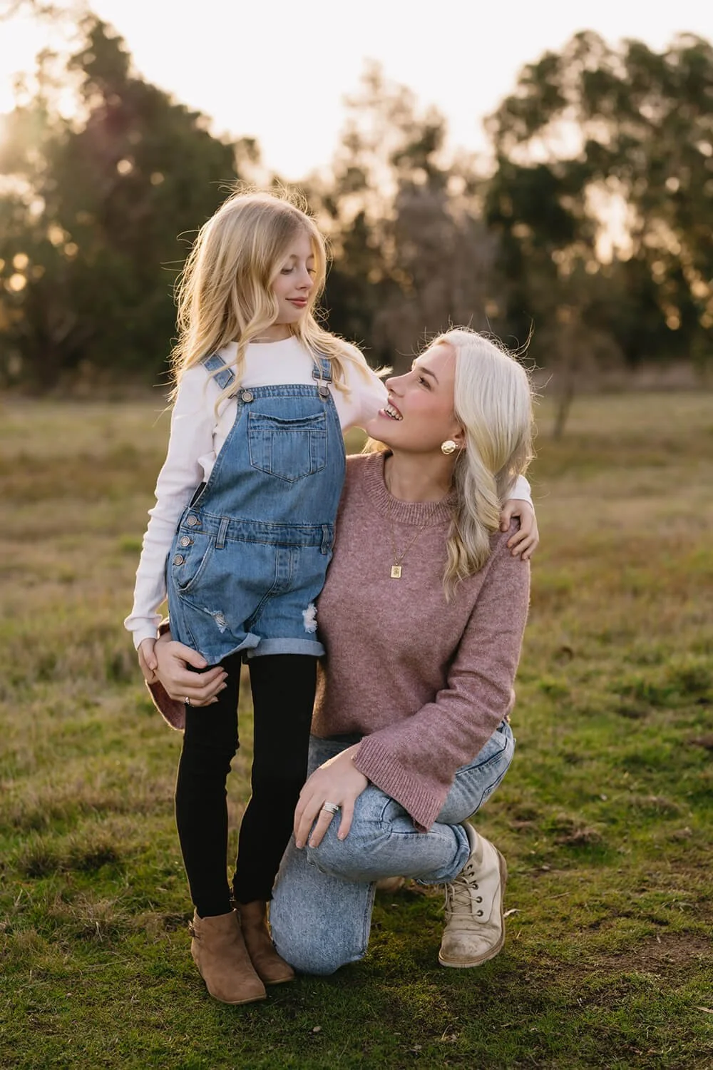 Hobart family photographer photographing a mum and daughter looking at each other at Hobart field