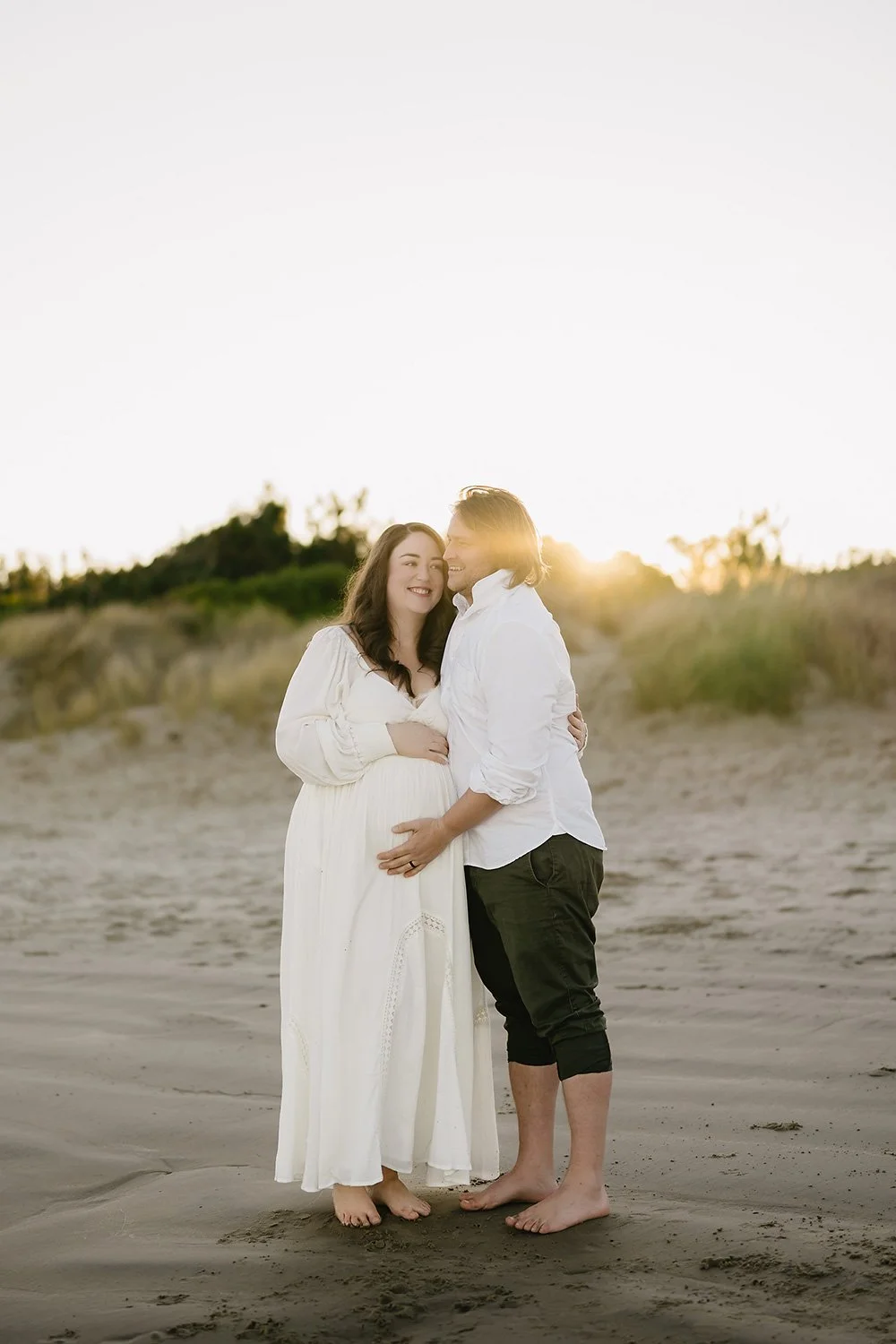 Pregnant couple on beach at Hobart maternity photoshoot