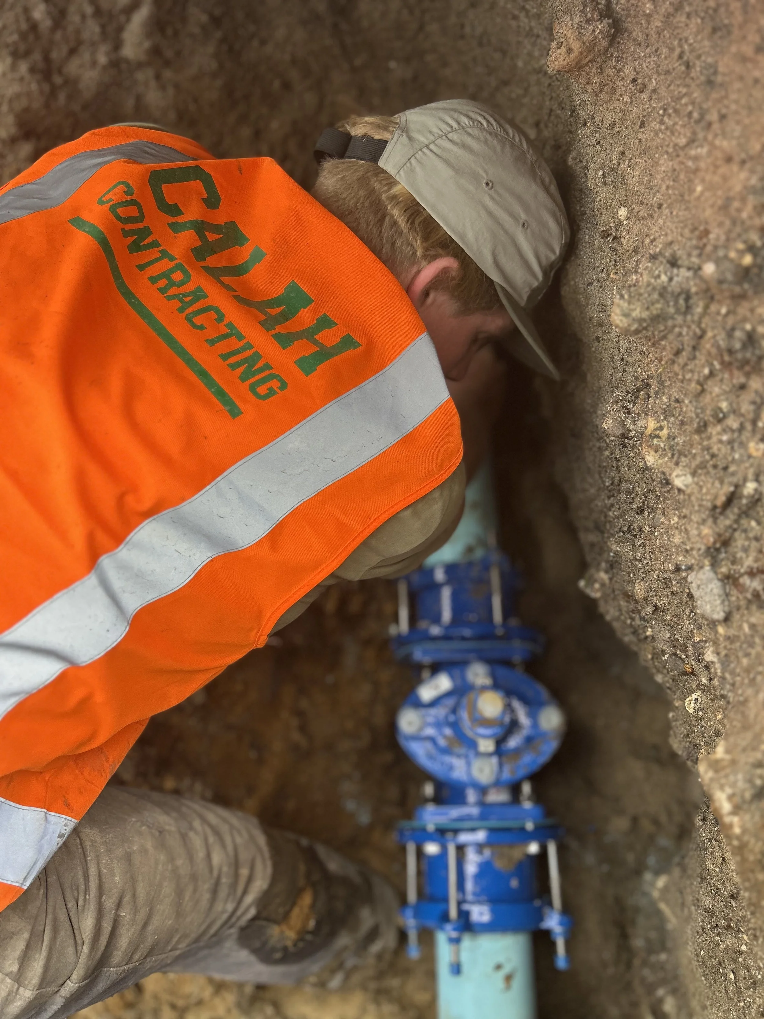 Civil construction site with workers and heavy machinery