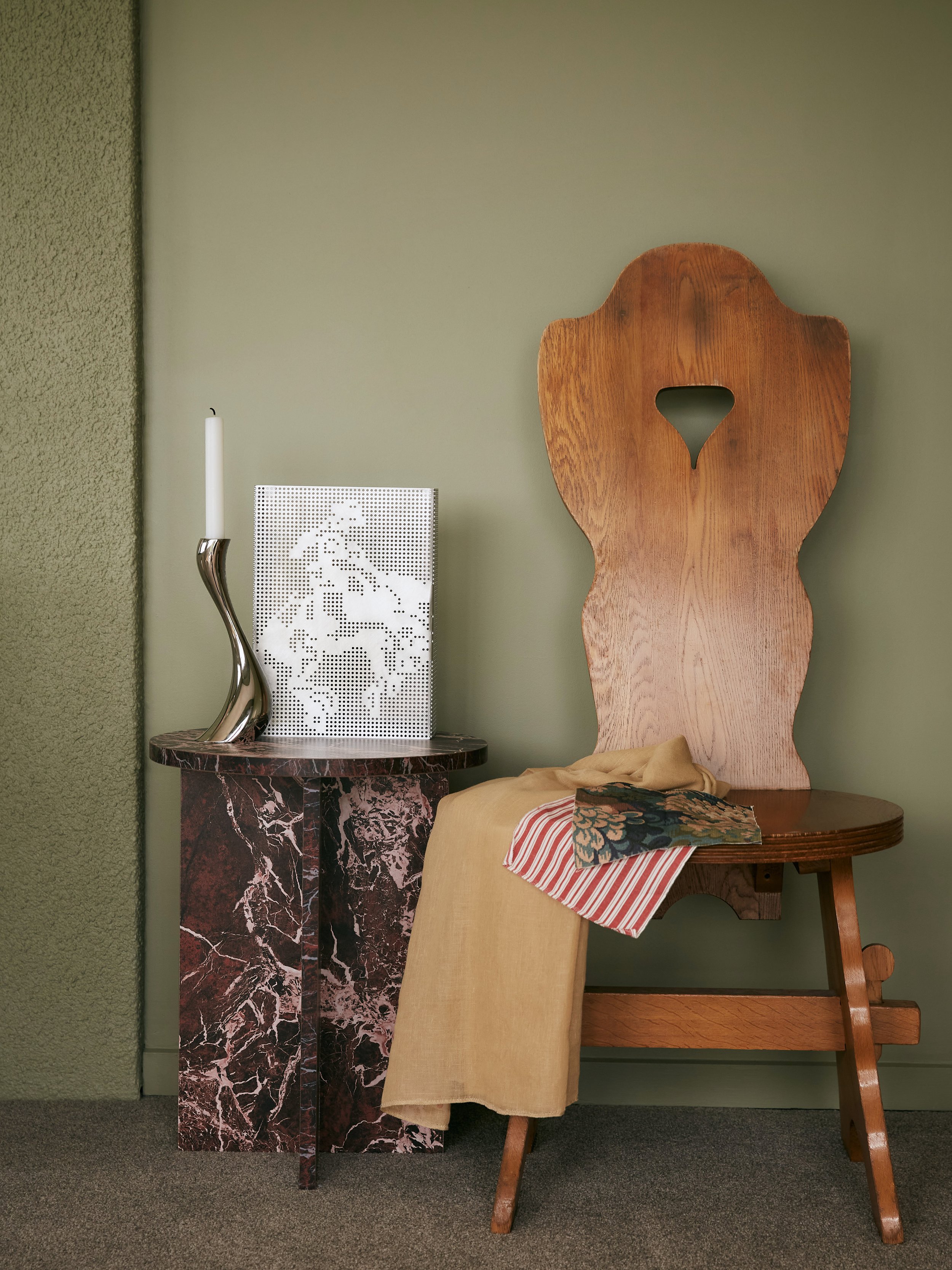 Characterful interior styling inspiration of a vintage chair with modern accessories and mixture of colourful and patterned fabrics, by Studio ZE.