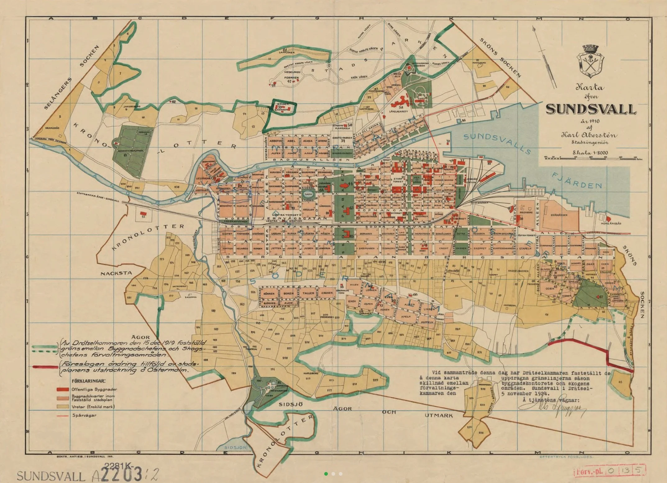 A detailed historical map of Sundsvall in 1910, showing streets, buildings, waterways, parks, and surrounding areas with color coding.
