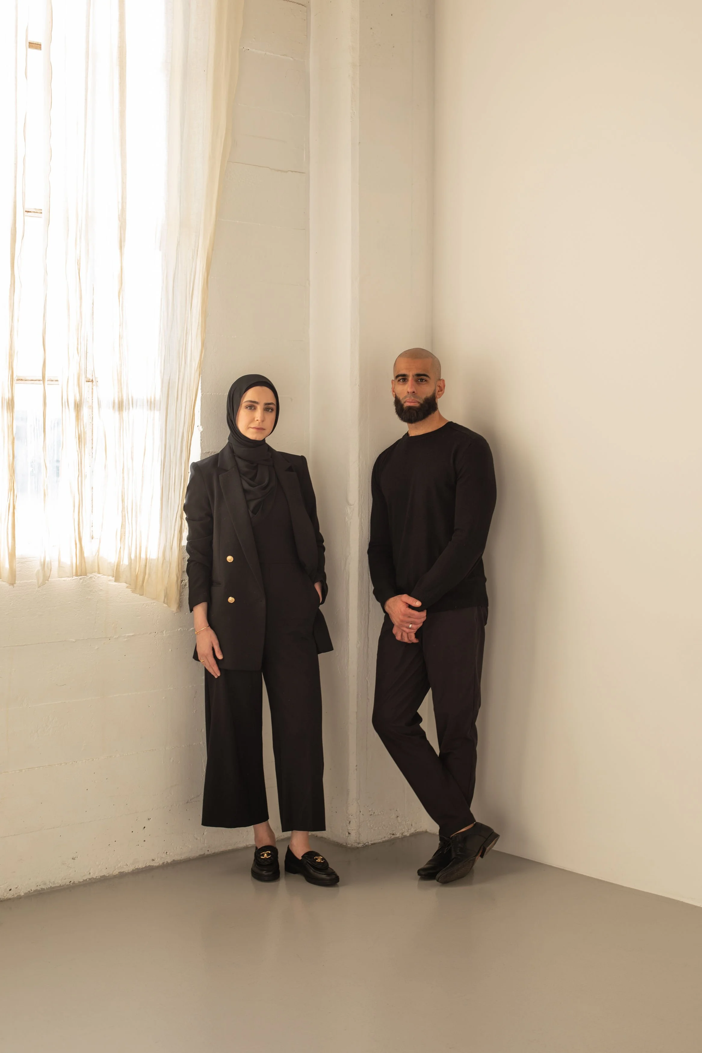 Siya Studio founders Tariq Abed and Rawan Kaddoura standing together against a neutral backdrop