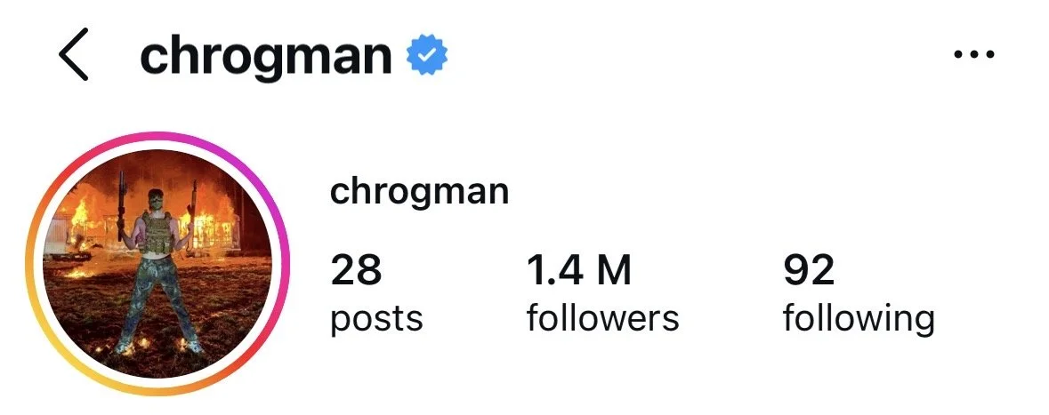 Instagram profile page of user 'chrogman' with 28 posts and 1.4 million followers, showing the profile picture of a person standing in front of a burning house.