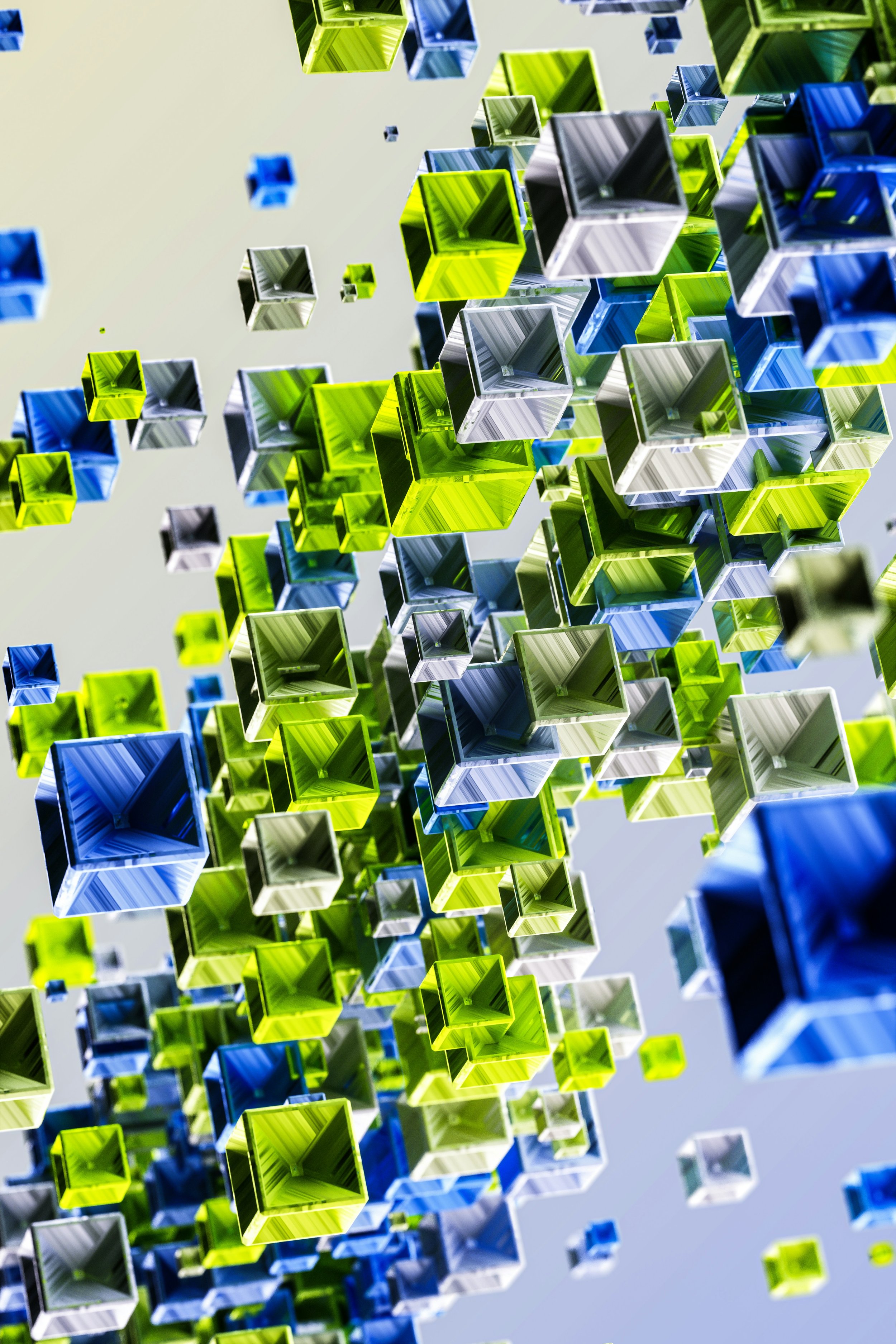 A digital art installation featuring numerous floating hollow cubes in blue, green, black, and white colors, arranged in a dynamic, three-dimensional pattern against a light background.