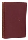 A maroon hardcover book standing upright.