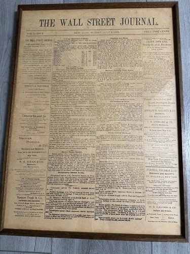 Framed, antique front page of The Wall Street Journal newspaper.