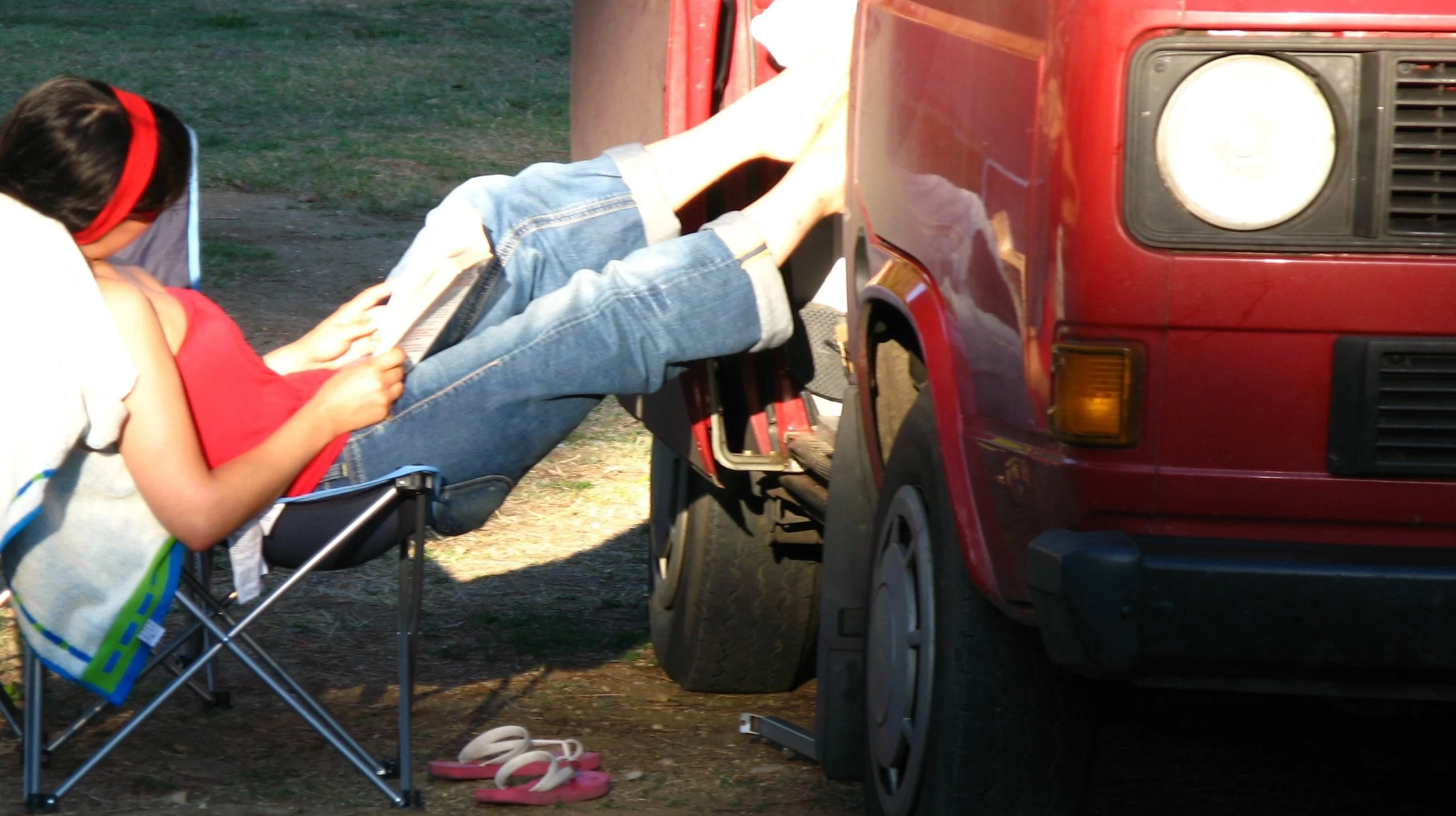 Vicky Watt from Acoustic Wave relaxing and reading a story during her freewheeling campervan adventure