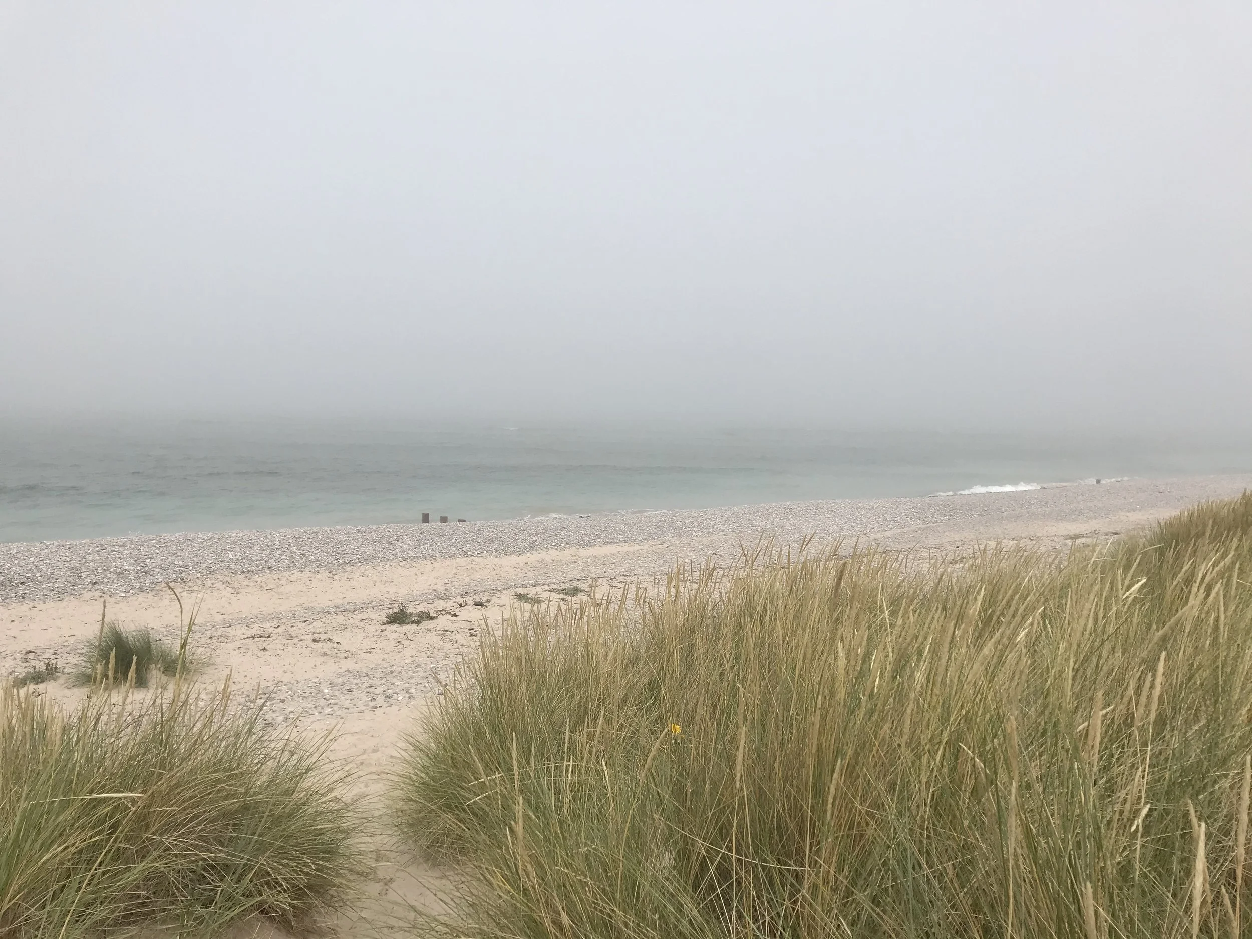 Hazy, foggy beach represents power of creating clarity with Wellbeing Coaching