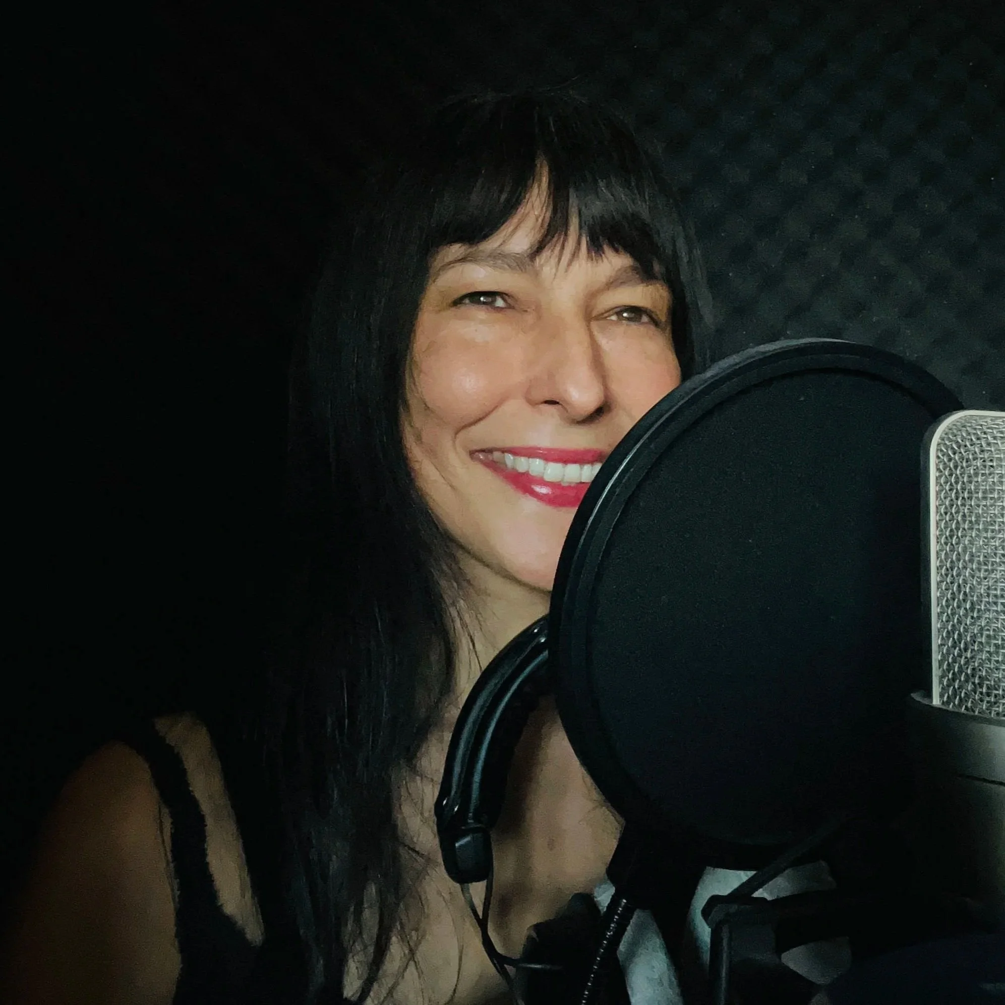 Vicky Watt, a Scottish female voice over artist, in her studio