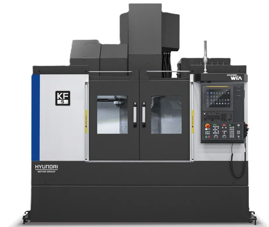 A Hyundai KF 5 CNC machine with control panel on the right and enclosed working area in the middle.