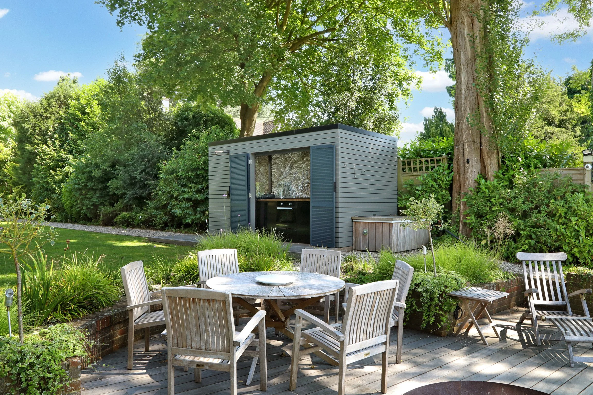 The river deck with outdoor kitchen and boat house