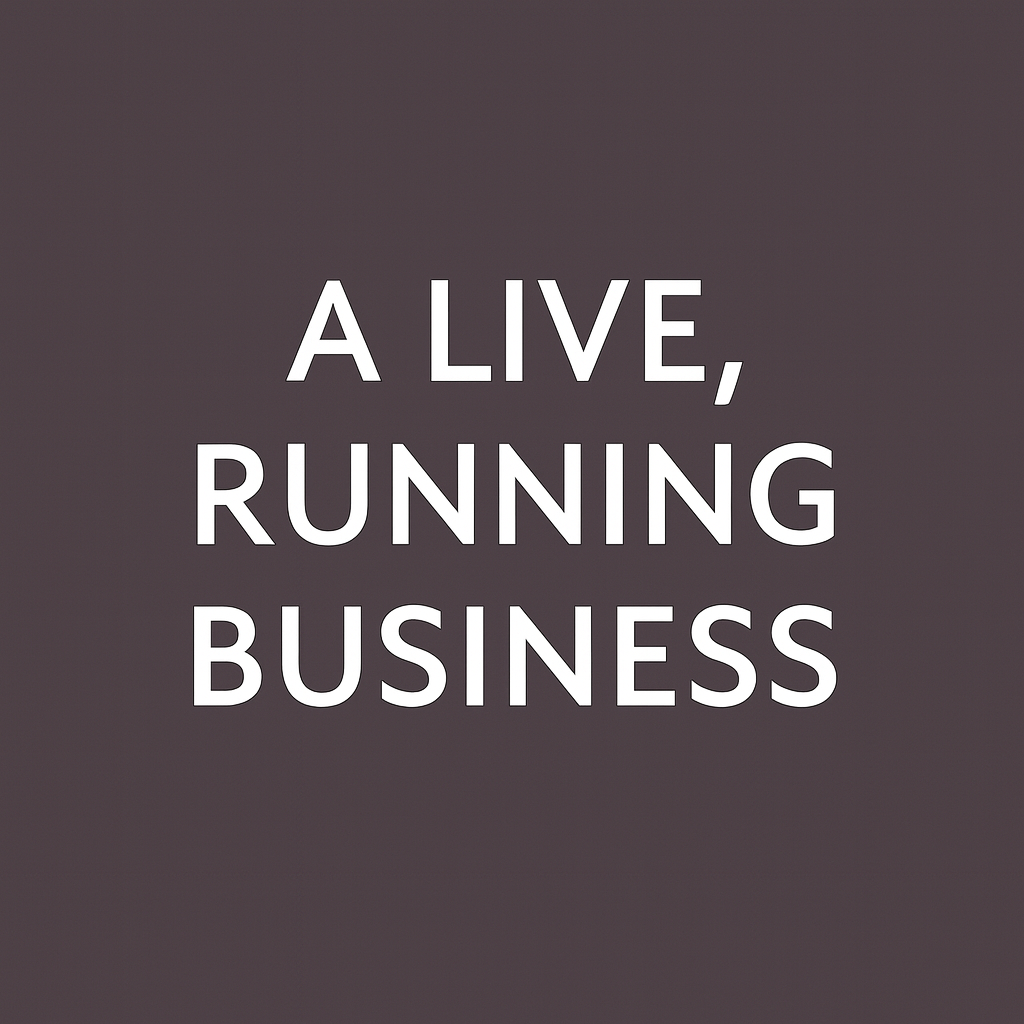 Motivational quote on a dark gray background: "A LIVE, RUNNING BUSINESS" in white capital letters.