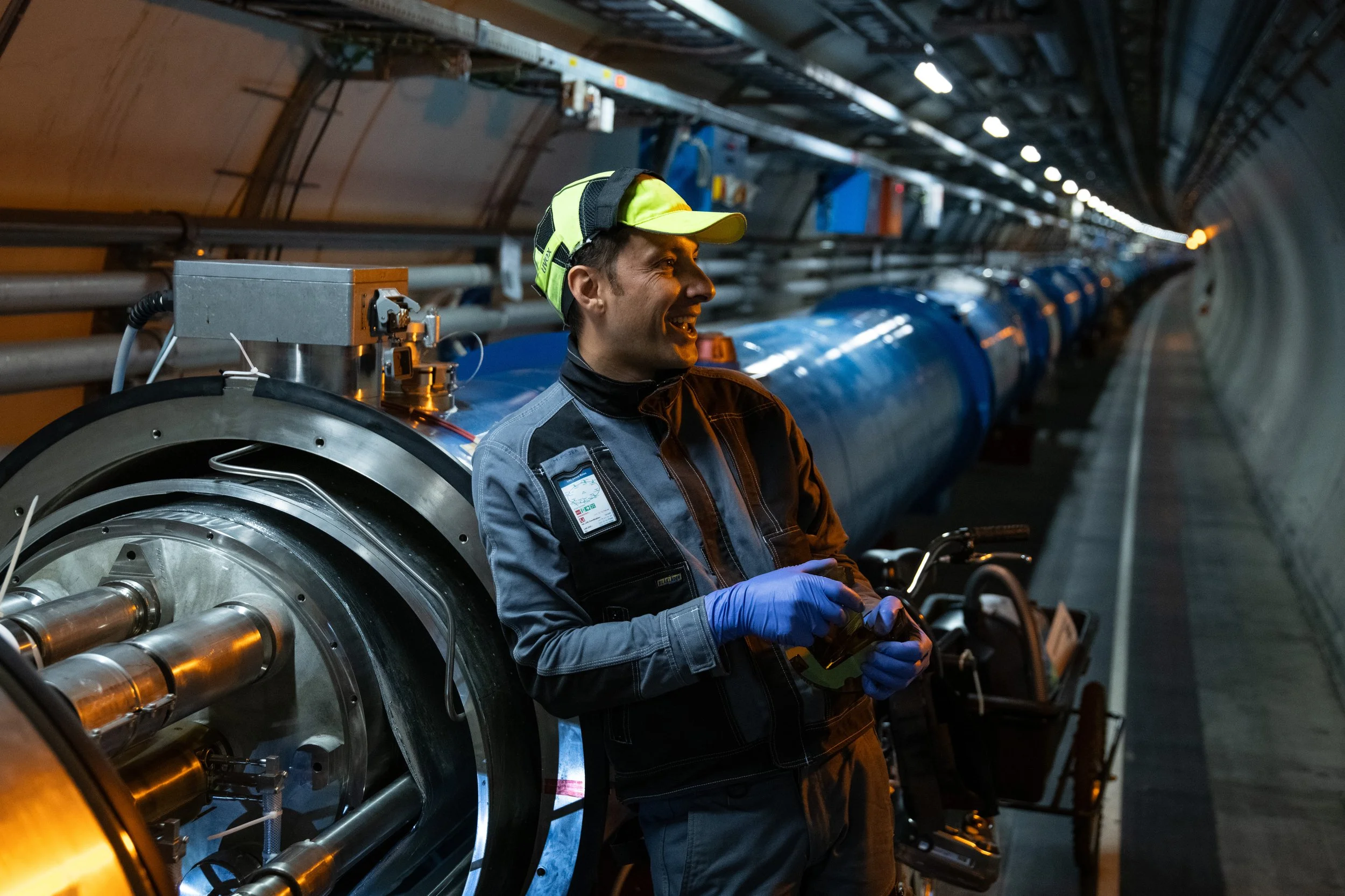 CERN technician working inside the Large Hadron Collider tunnel