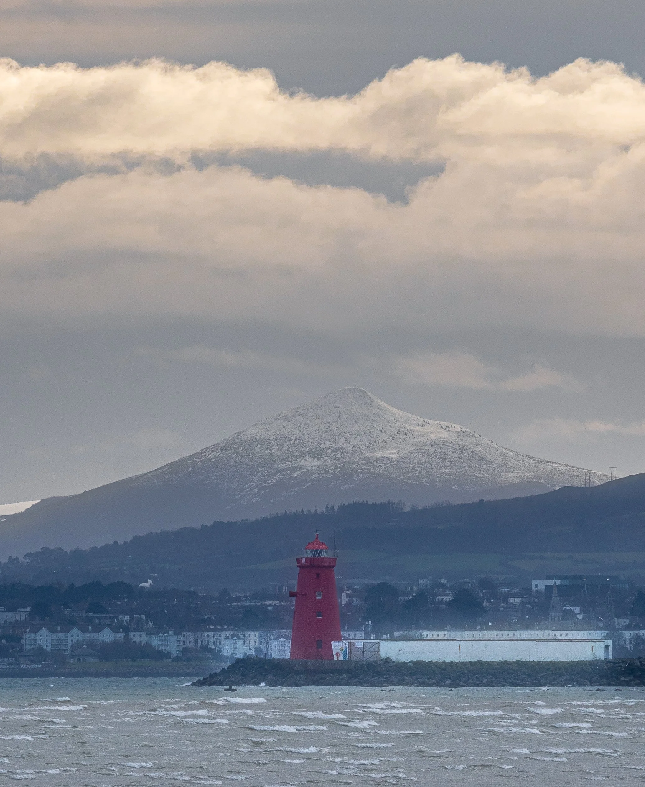 Poolbeg Lighthouse with Snow-capped Sugarloaf Mountain