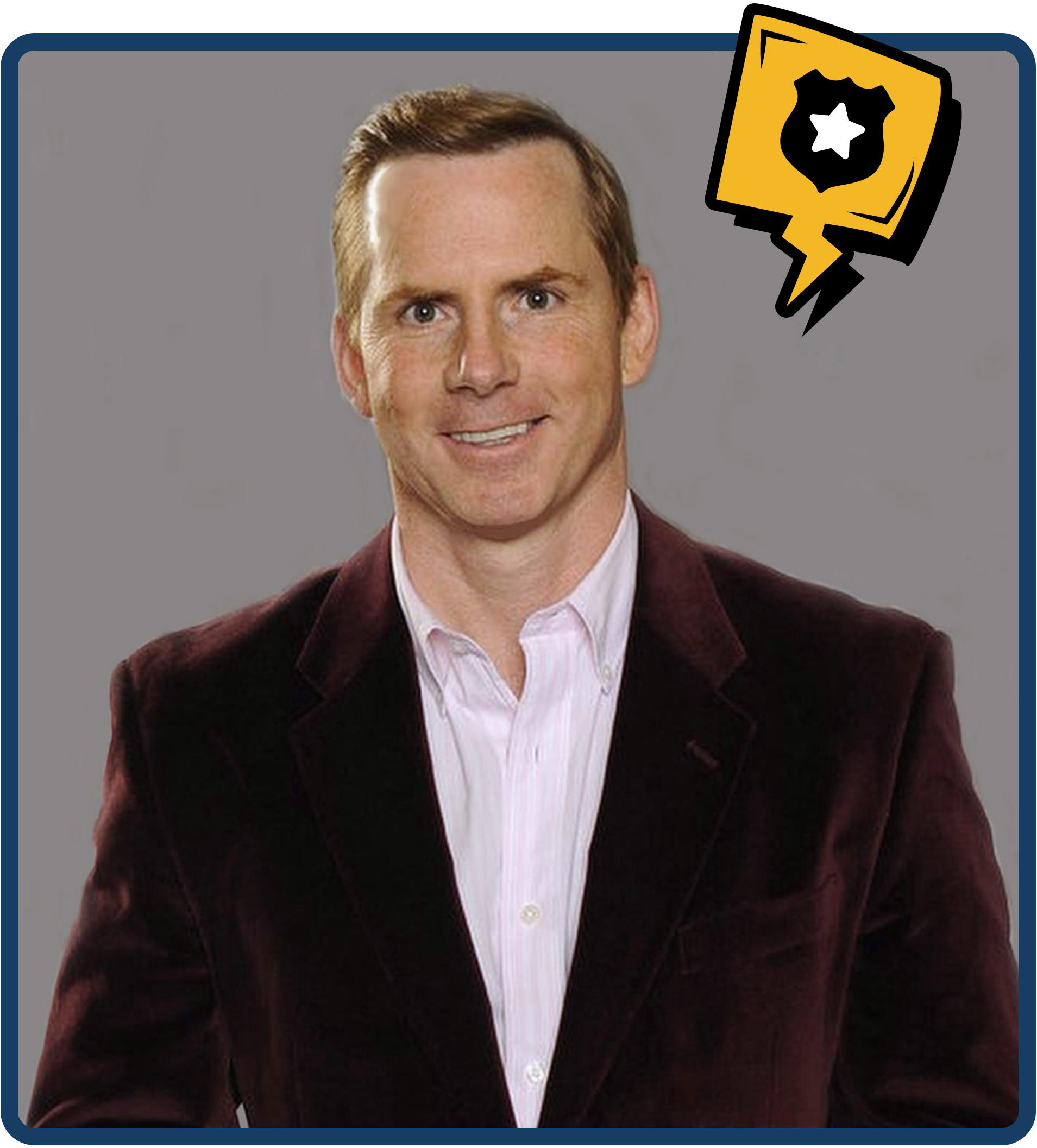 A man wearing a white shirt and a maroon blazer, smiling against a gray background with a comic-style police badge icon in the top right corner.