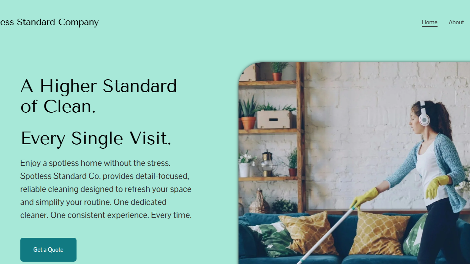 A woman vacuuming a living room with a white brick wall, wooden shelves with plants and decor, wearing yellow gloves, a white shirt, gray cardigan, and headphones.