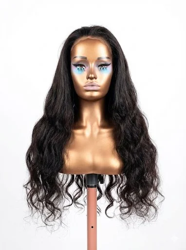 A mannequin head with long, wavy black hair and makeup, mounted on a stand against a plain white background.