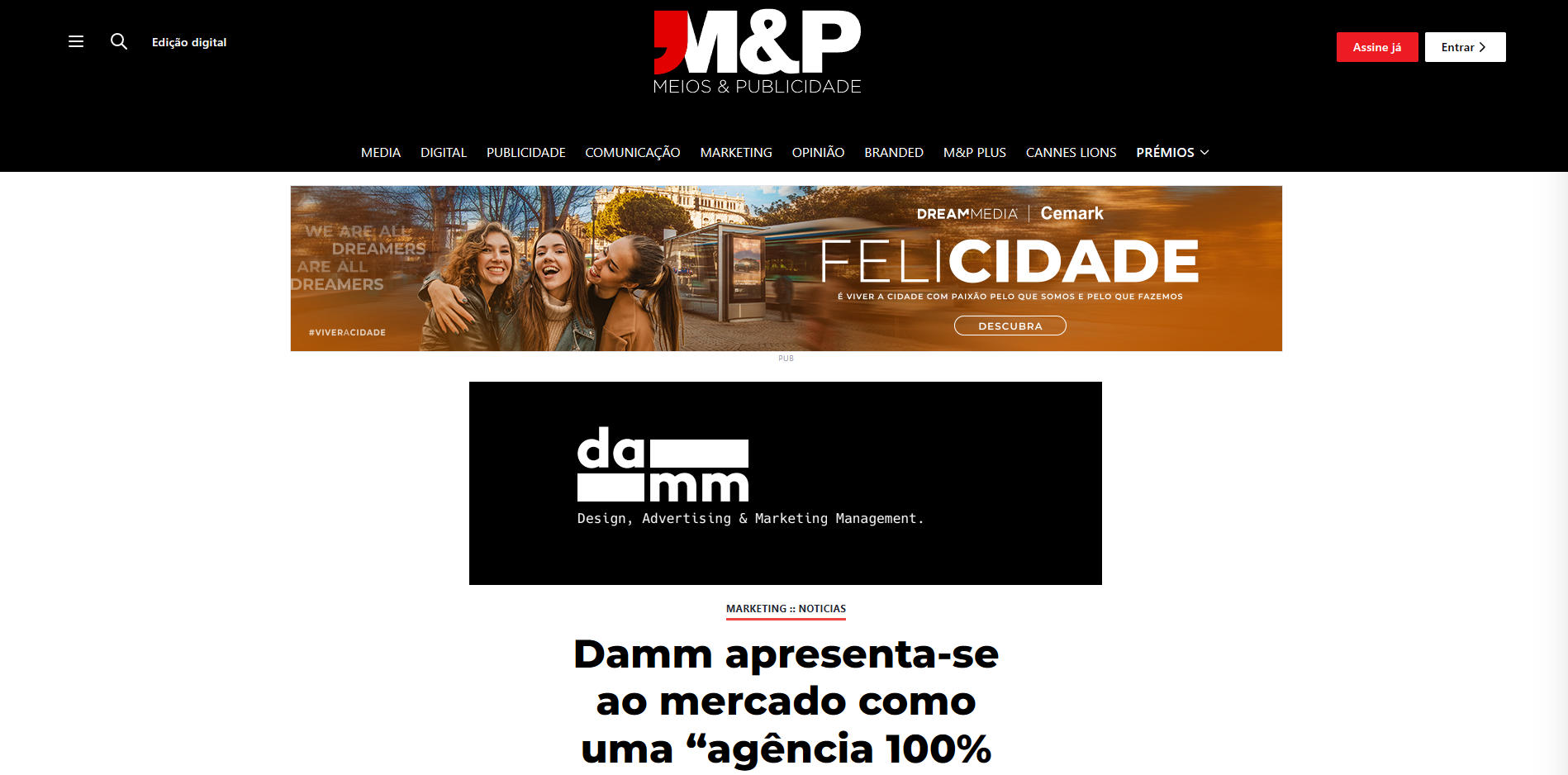 M&P Meios & Publicidade website homepage featuring a banner with three smiling women, and the text "Damm apresenta-se ao mercado como uma 'agência 100%'"
