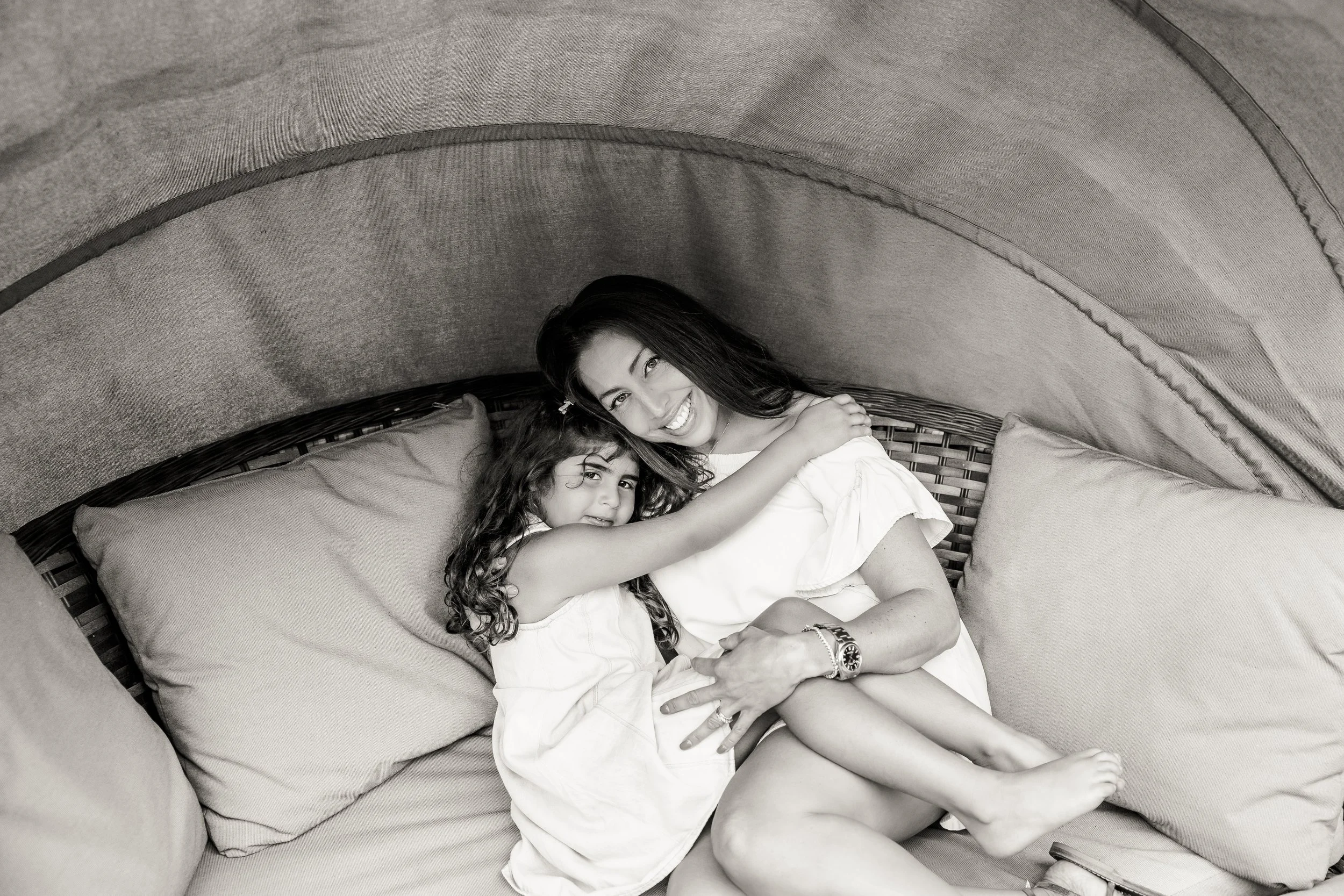 A mother and daughter sharing a joyful moment, reflecting the positive psychology goal of deeper connection and emotional wellbeing for women