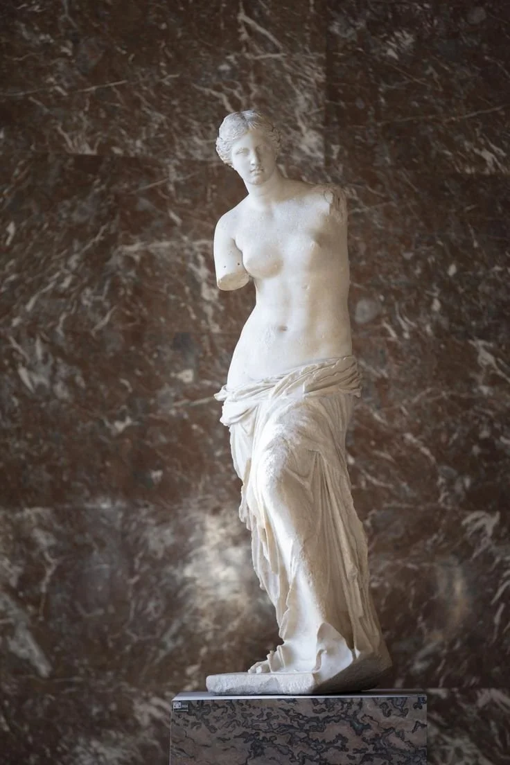 Ancient Greek marble statue of Venus de Milo, displayed at the Louvre Museum in Paris