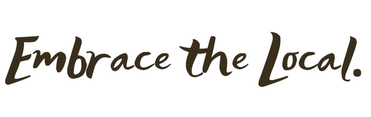 Text saying "Embrace the Local." in a cursive font.