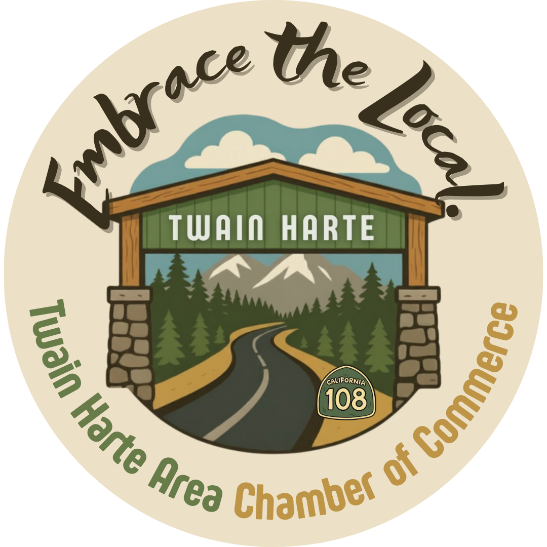 A badge with a mountain landscape, a road, trees, and a blue sky with clouds. It features the text 'Embrace the Land!' at the top, 'TWAIN HARTE' in the center, and 'Tuolumne Hte Area Chamber of Commerce' at the bottom, with a California Route 108 sign.