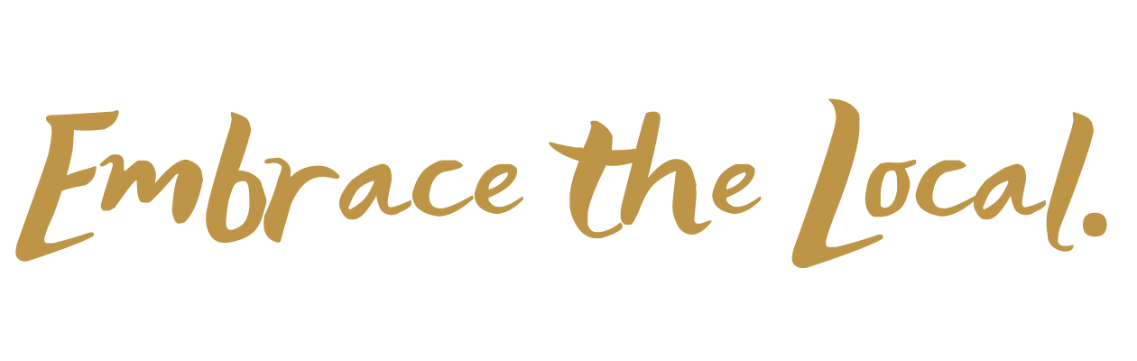 Text that reads 'Embrace the Local' in brown cursive font on a black background.