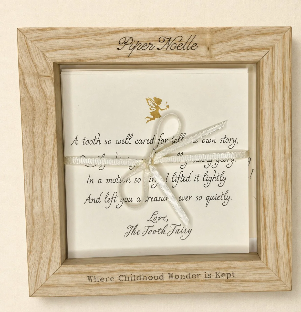 Personalized wooden Tooth Fairy keepsake box engraved with a child’s name and filled with Tooth Fairy notes