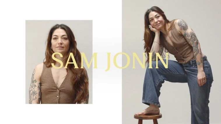 Portrait of a woman with long reddish-brown hair, tattoos on both arms, wearing a sleeveless brown top and jeans. The image is split into two sections, with the woman's name "SAM Jonin" written in large yellow letters across the center.