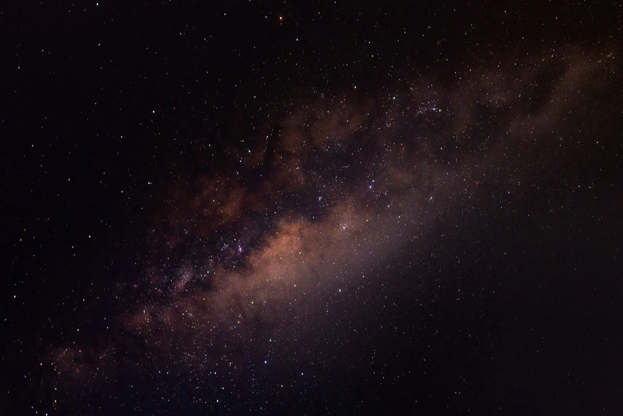 Starry night sky with visible galactic band and countless stars.