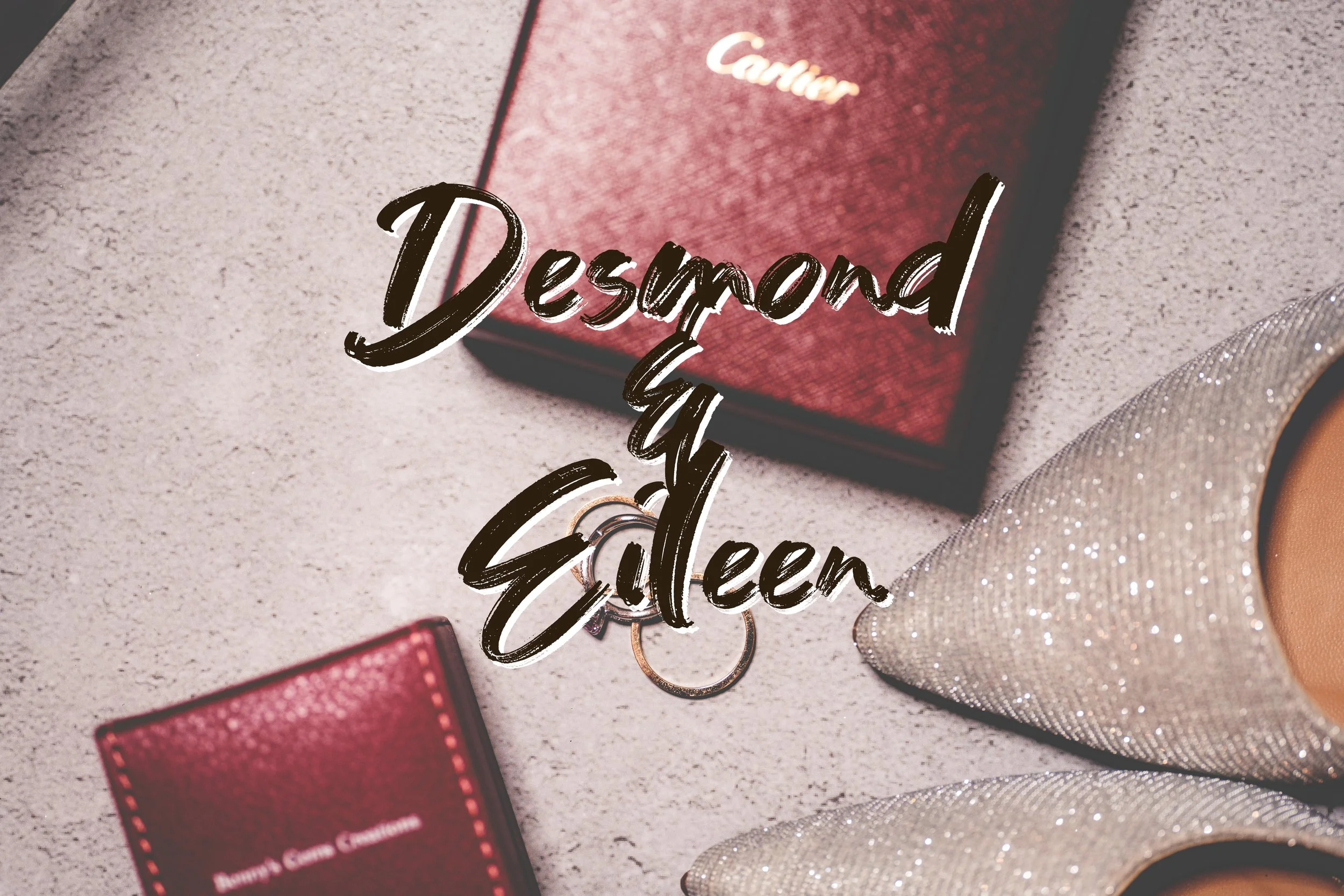A pair of sparkly high heels, a Cartier box, and rings on a beige surface with the words 'Desmond & Edelien' written across the image.