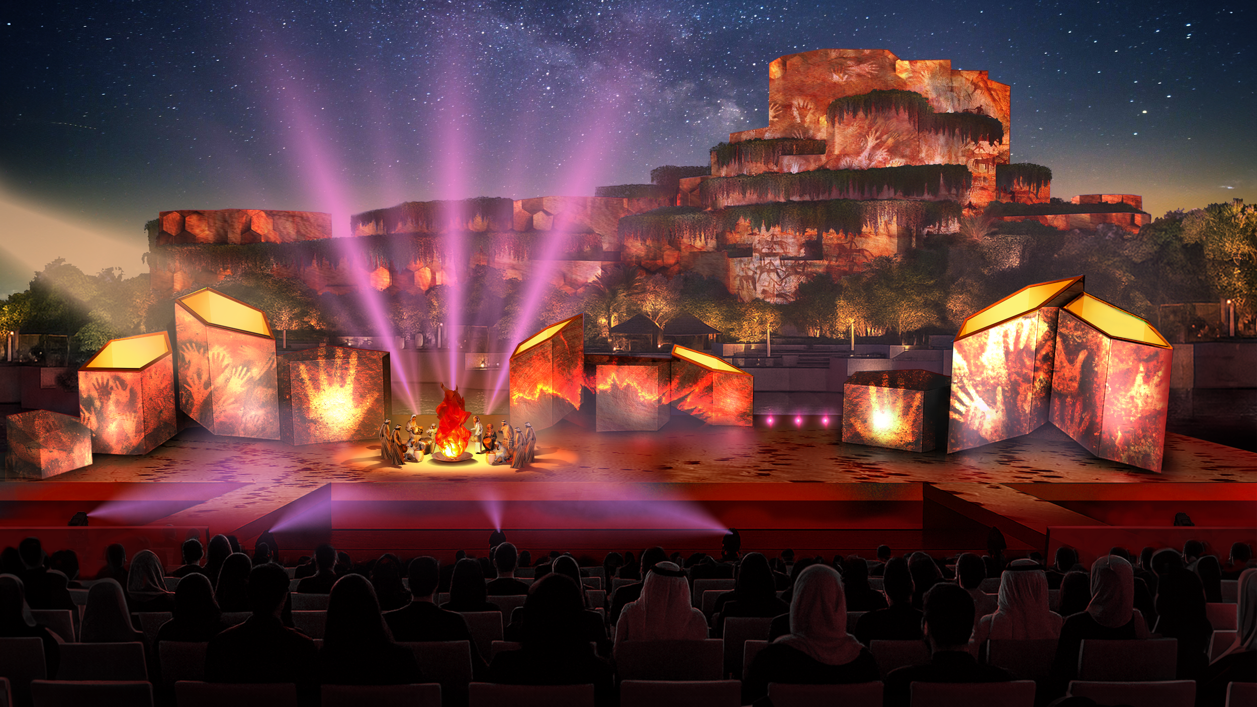 Una scena teatrale all'aperto di notte con un pubblico seduto, uno spettacolo con luci viola e un grande sfondo roccioso illuminato.