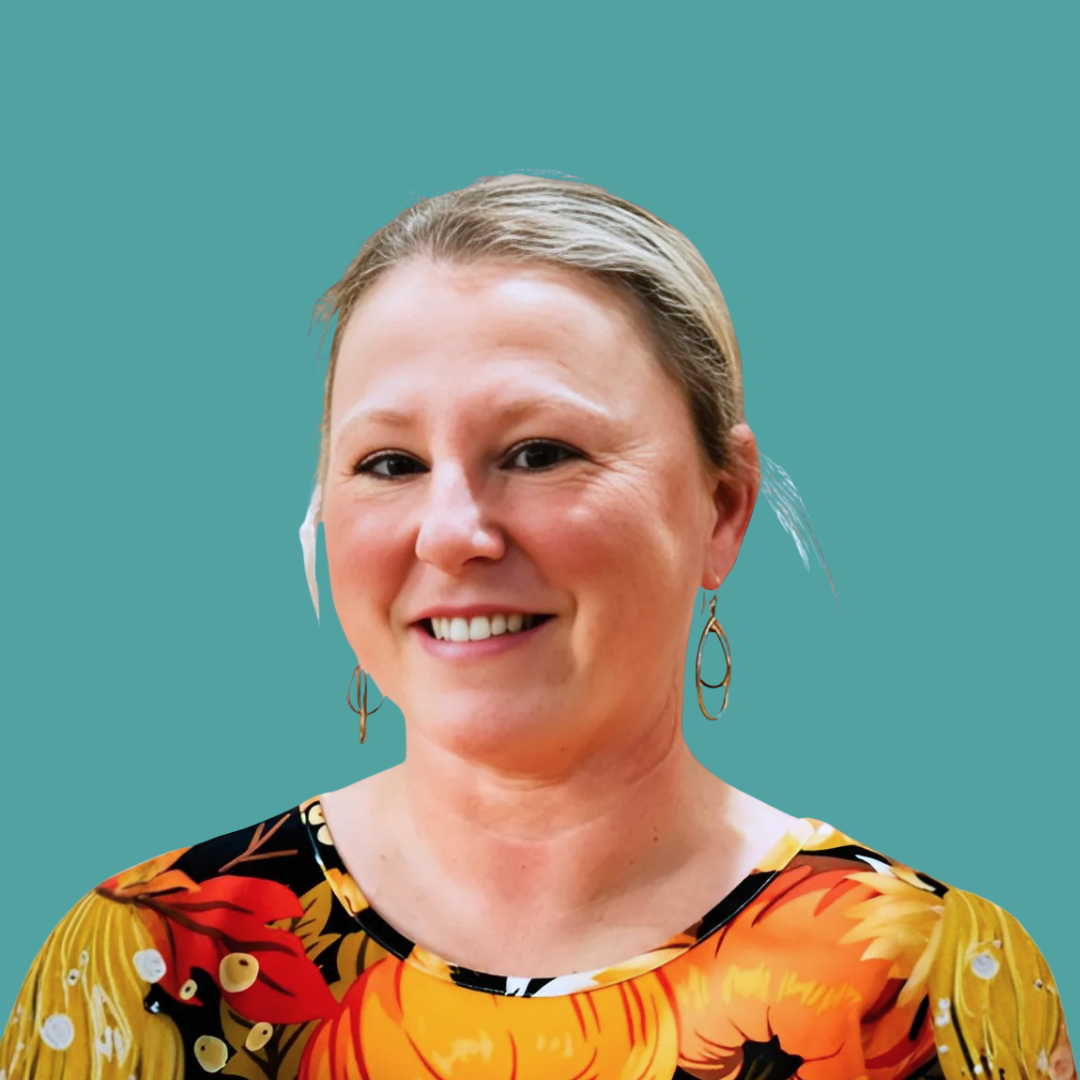 Headshot of a smiling woman with short brown hair, wearing earrings, against a teal background.
