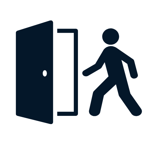 Silhouette of a person with a surfboard standing on a beach at sunset.