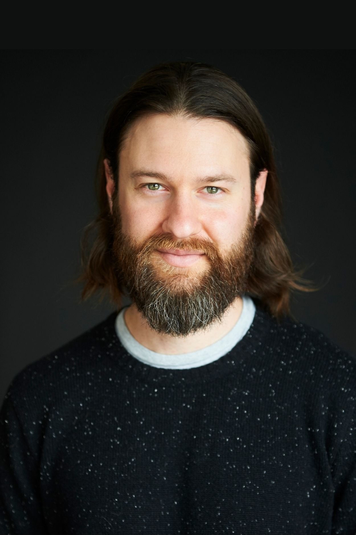 Headshot fot Adam Goldhopf