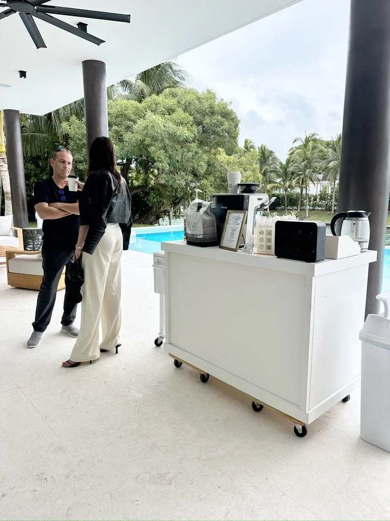 Luxury mobile coffee cart setup at a private event in Miami with guests and espresso service