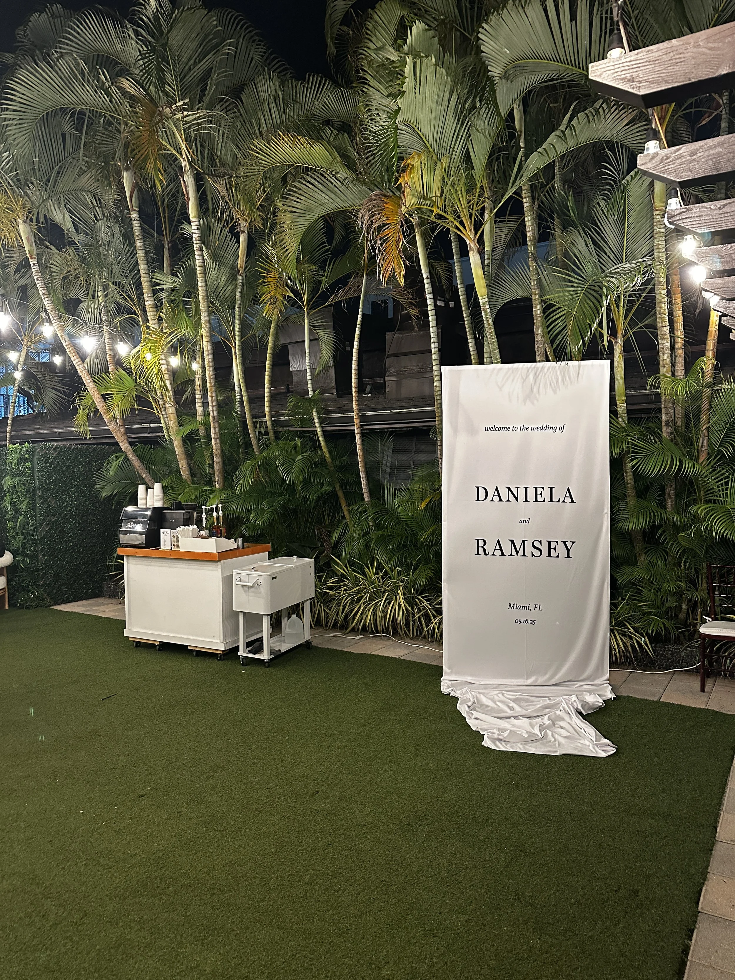 Wedding coffee cart setup in Miami with custom signage and outdoor luxury event styling