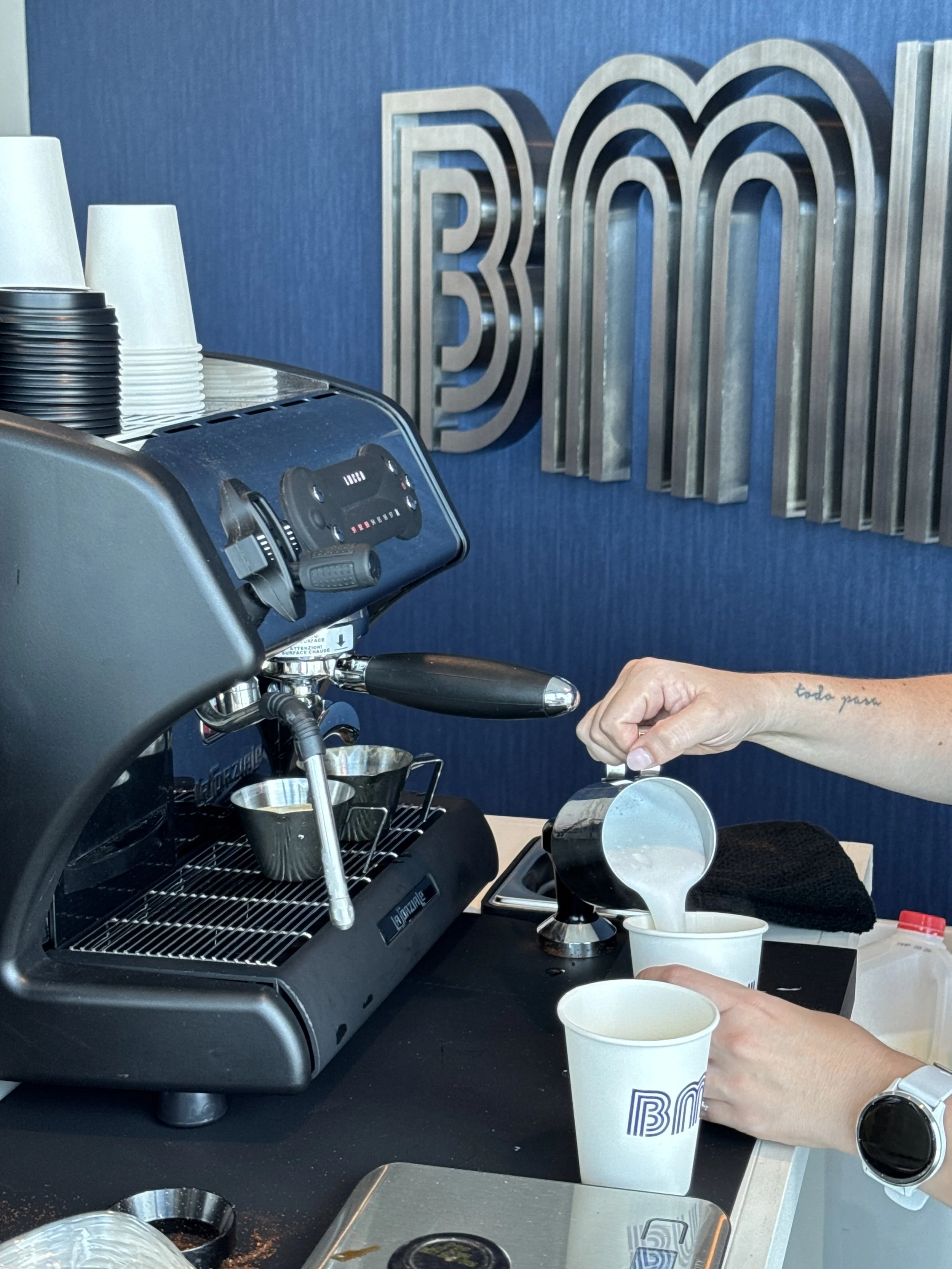 Barista preparing a latte at a corporate coffee catering event in Miami