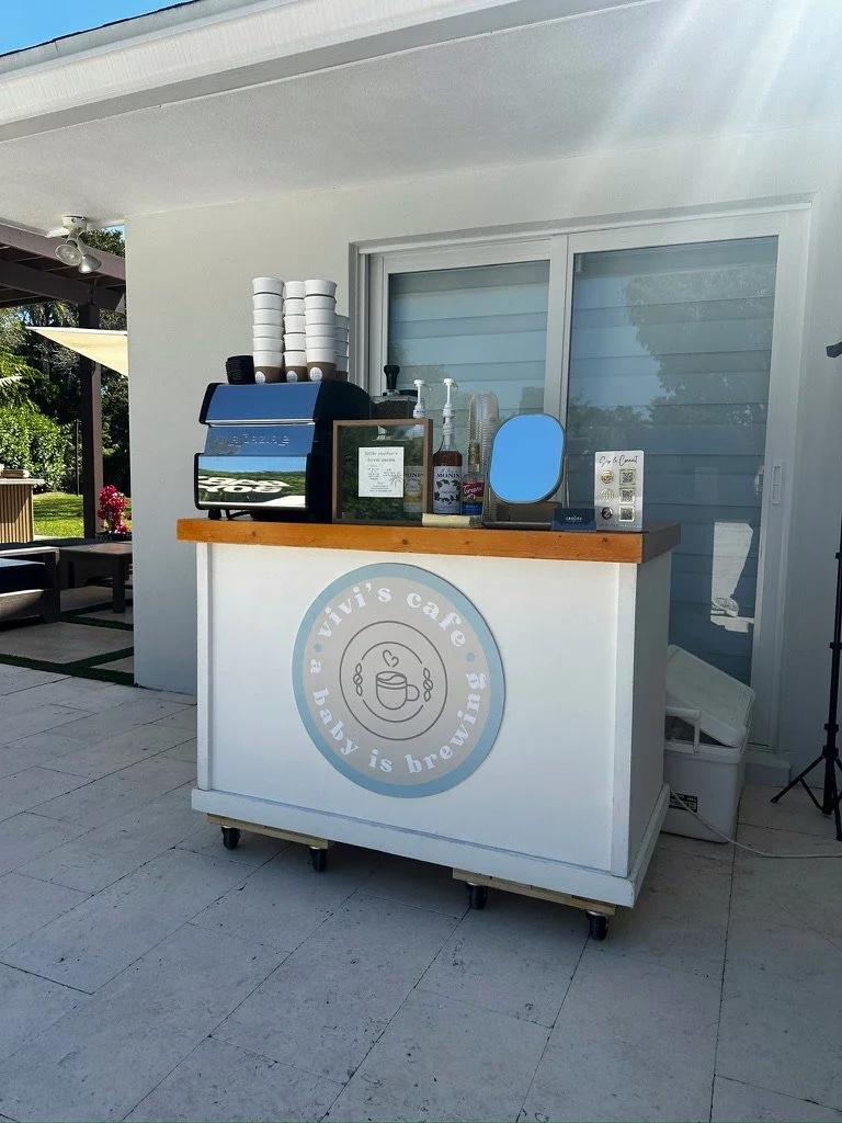 Outdoor mobile coffee cart setup in Miami with espresso machine and syrups for private event service