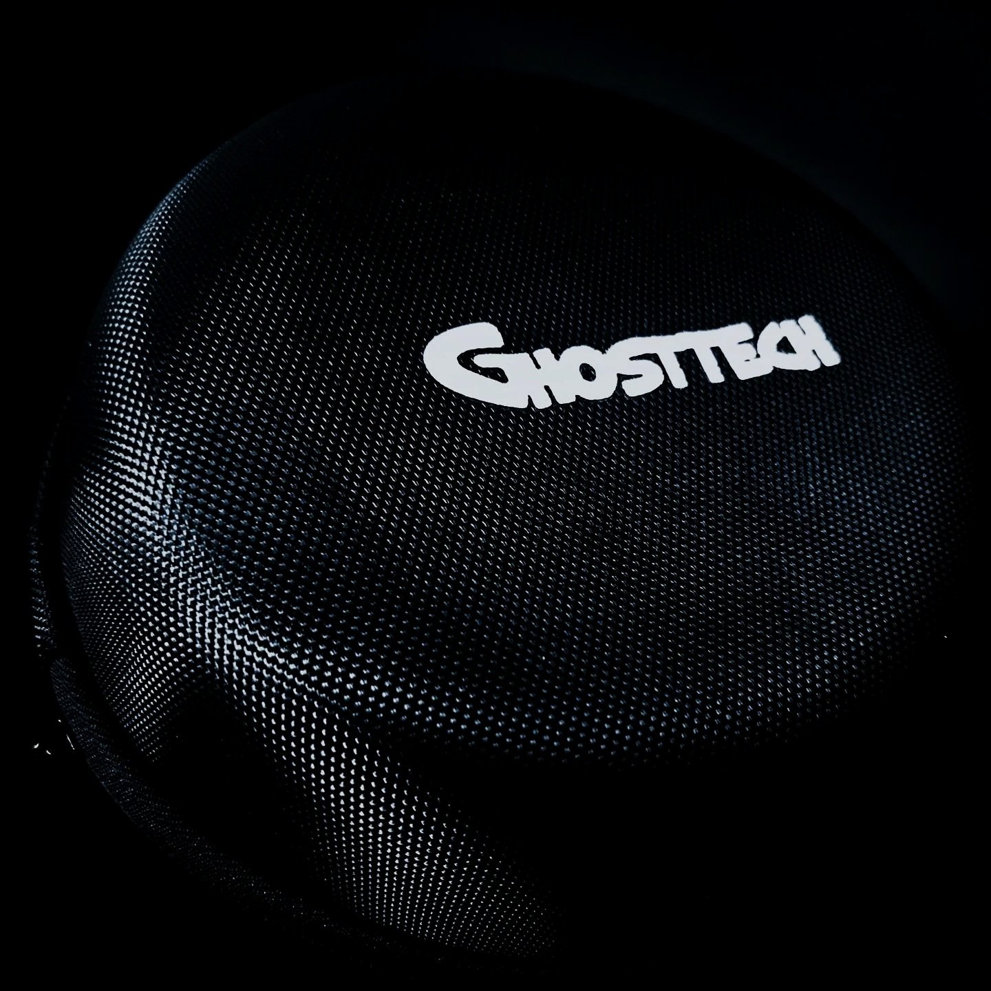 A Black GhostTech case with a dotted pattern and the GhostTech logo in white on top.