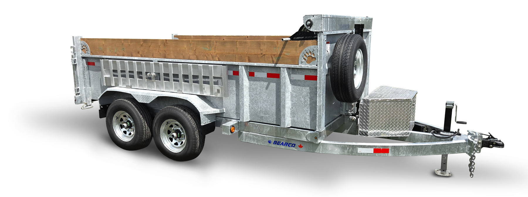 A dual-axle utility trailer made of galvanized metal with wooden side walls, a spare tire mounted on the front, and a lockable toolbox at the front. It has a hitch for connecting to a vehicle and reflective red tape along the sides.
