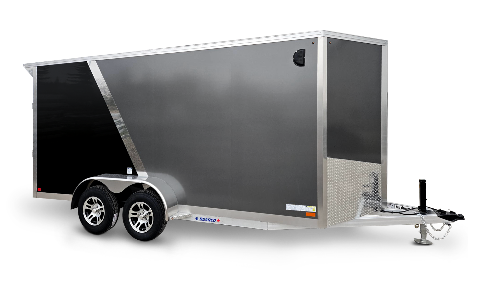 A black and silver enclosed cargo trailer with dual axles and a hitch for towing.