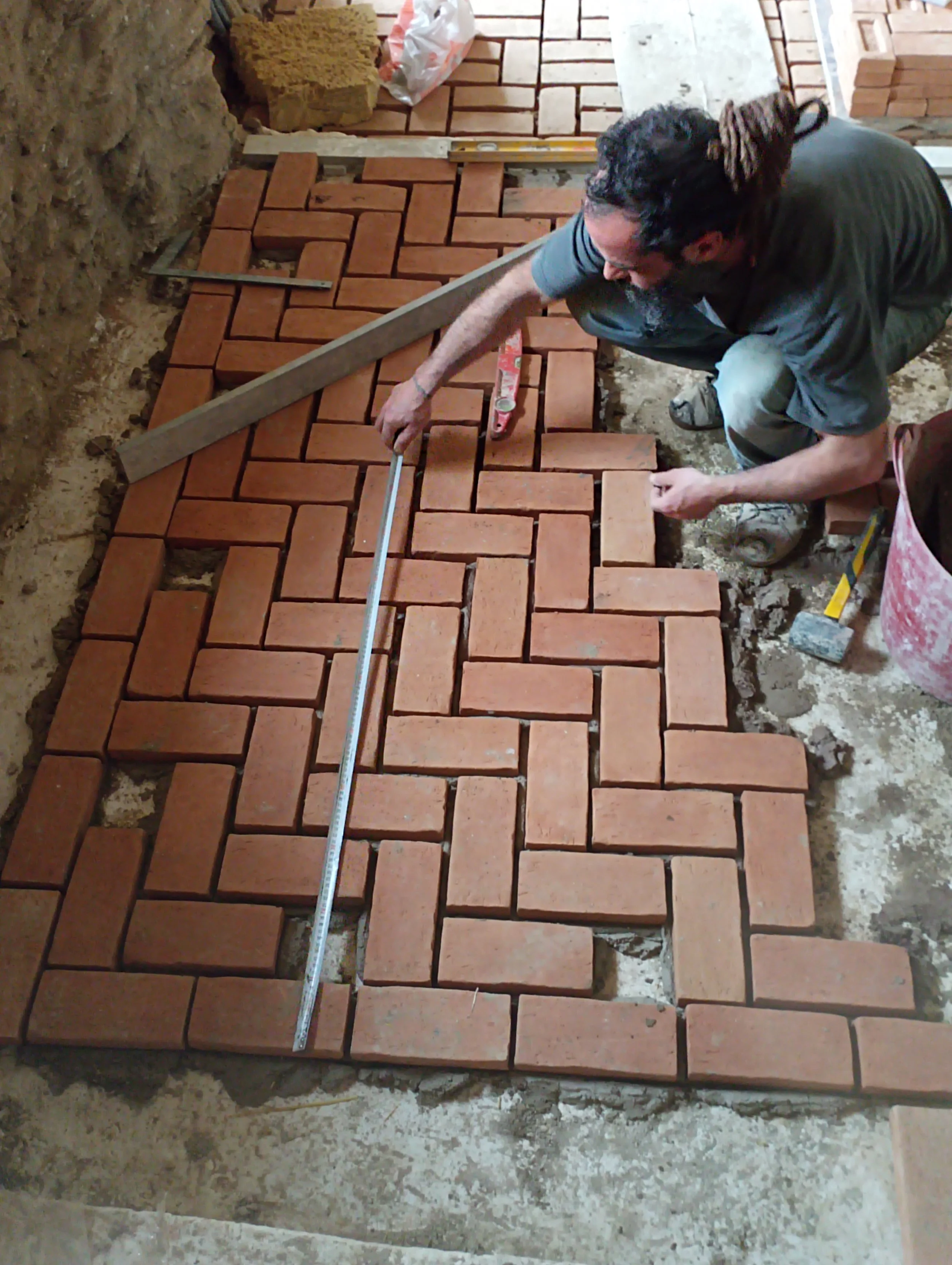 Yiannoulis masterfully laying brick