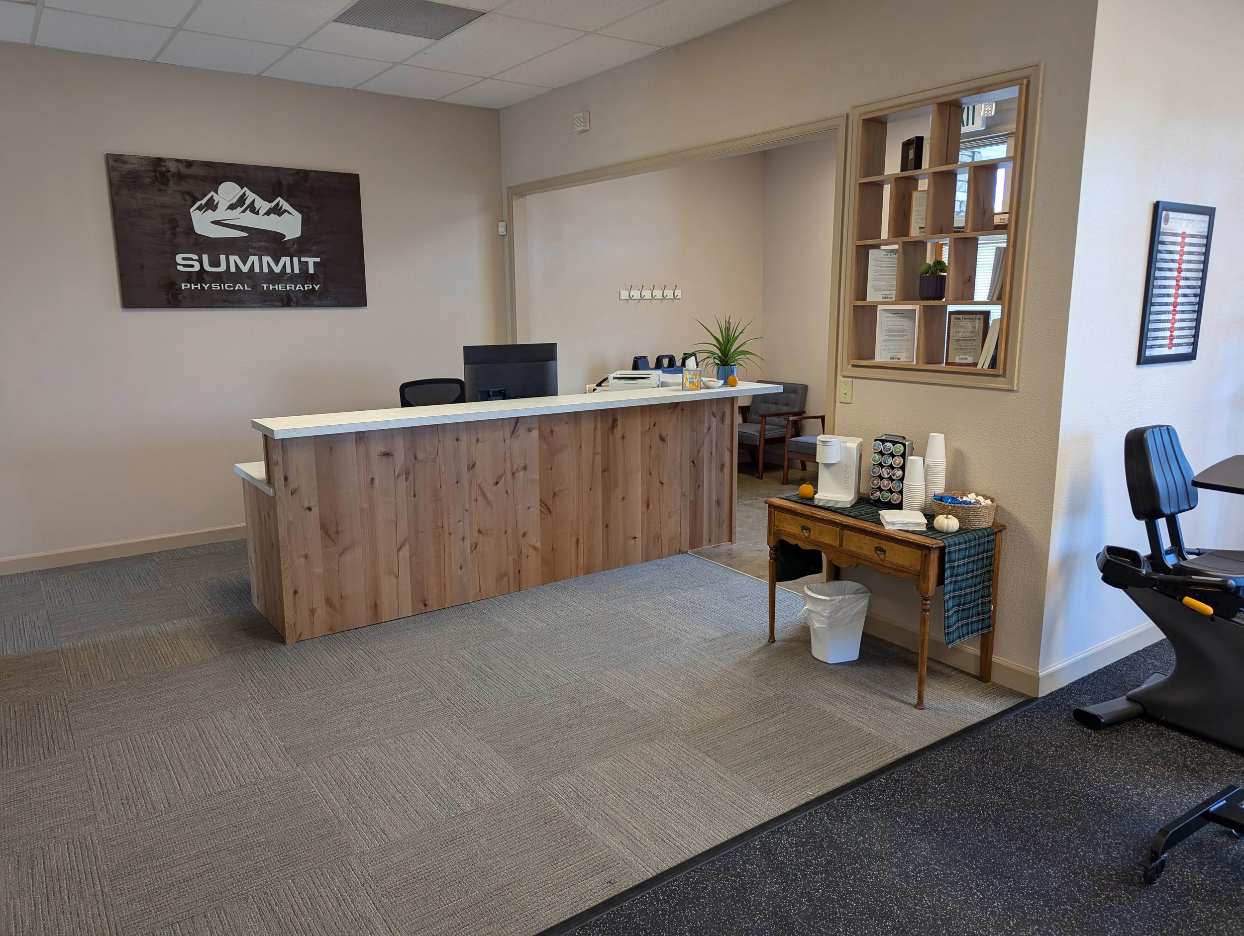 Reception area build-out in Boise Idaho with custom wood desk and functional office layout by tenant improvement contractor