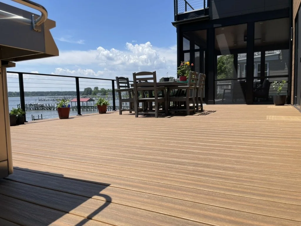 DuxxBak decking board in Cedar color with Black Metal Posts and Stainless Steel Cable Railing