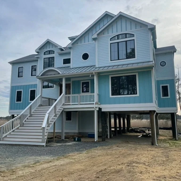 Multi-story deck built on stilts. Cable railing and custom posts in Rehoboth Beach, Delaware.